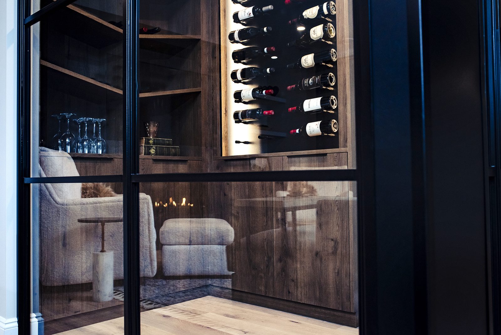 Chestermere wine wall behind black-framed glass
