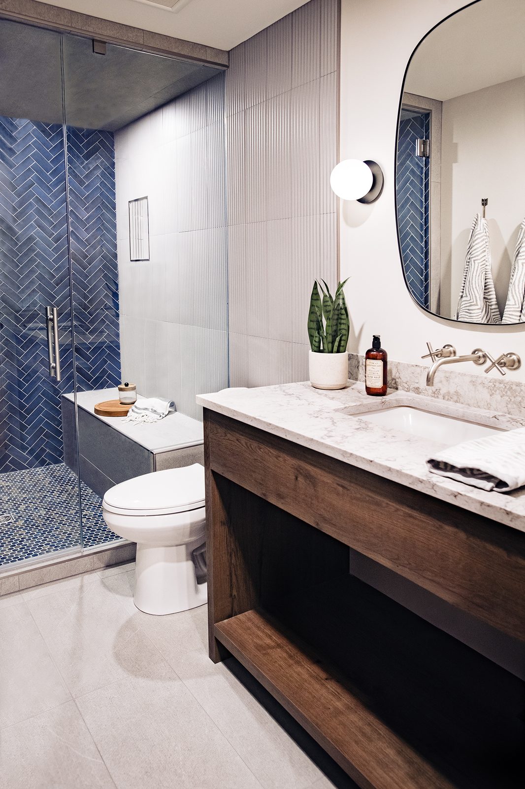 Chestermere bathroom with blue herringbone tile